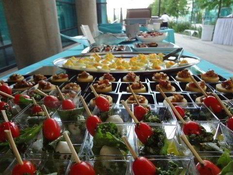 Passed appetizers and small plates laid out for a 360 Catering event