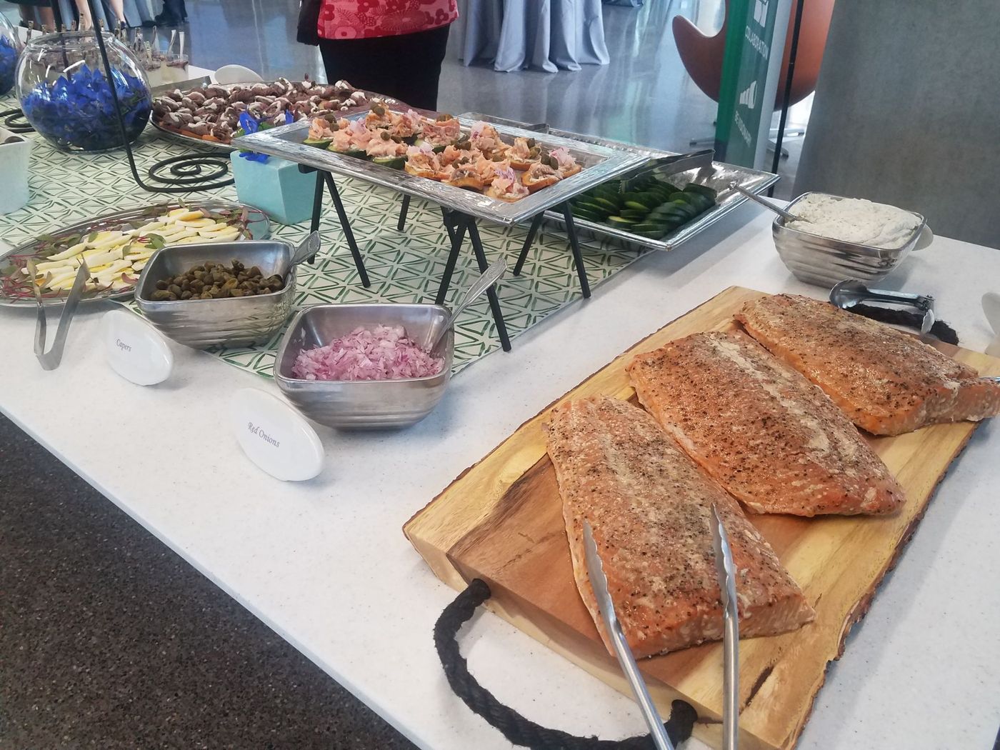 Smoked salmon and buffet stations laid out by 360 Catering