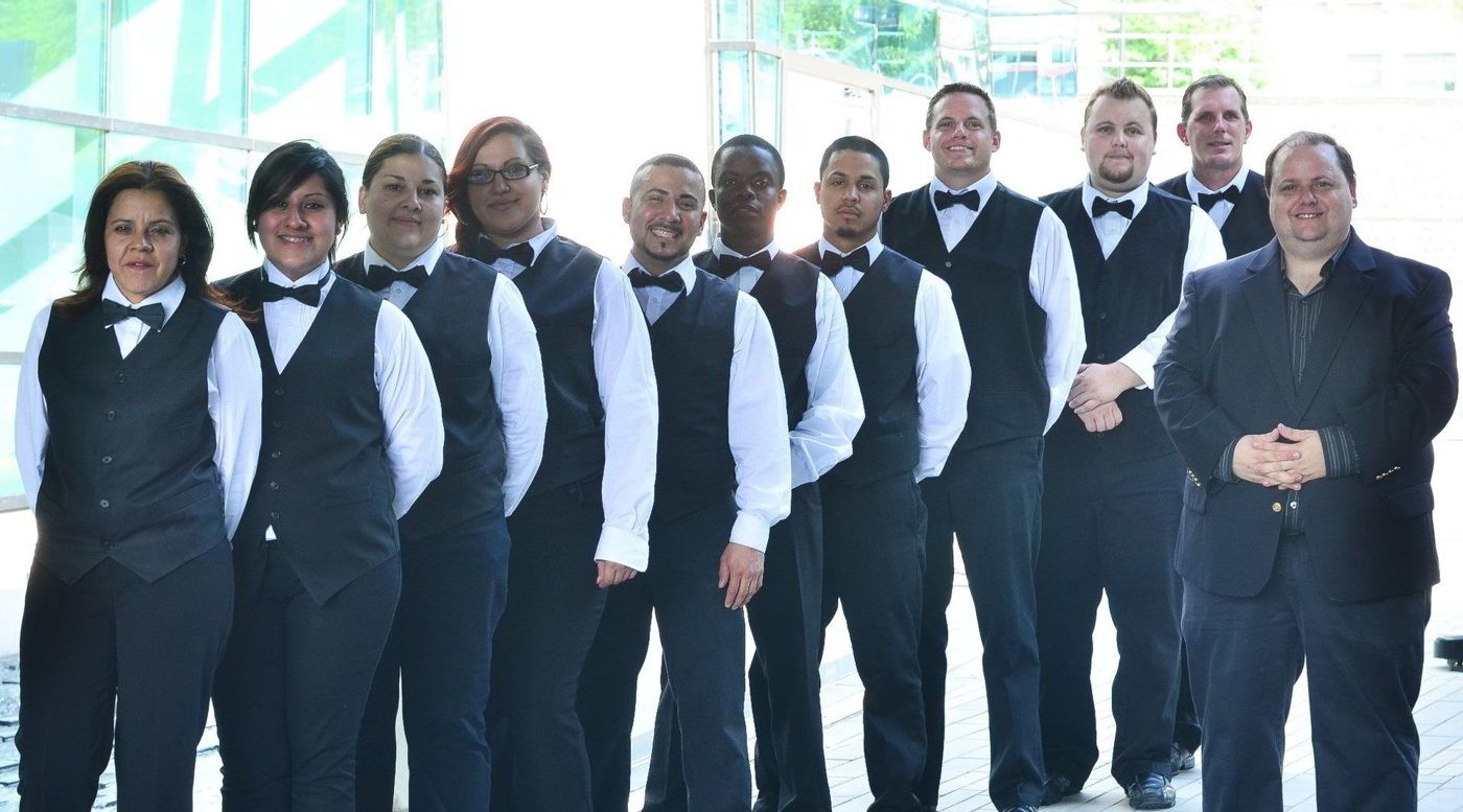 The 360 Catering and Events serving team in uniform